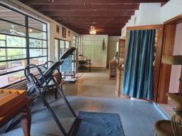 Florida room runs the length of the home and opens to a large screened patio