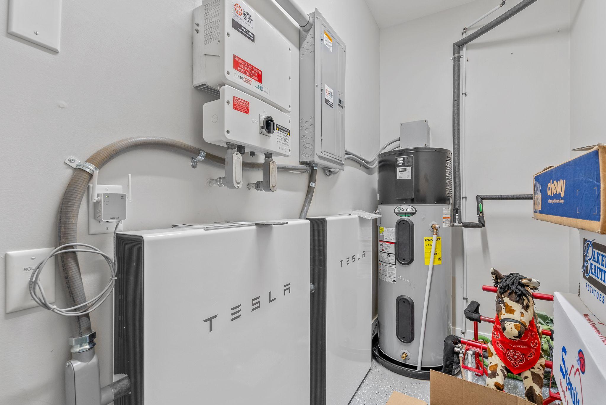 Telsa Back Up Batteries and hot water heat pump